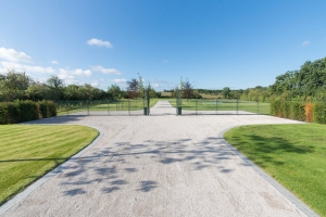 long commercial gravel driveway and gates