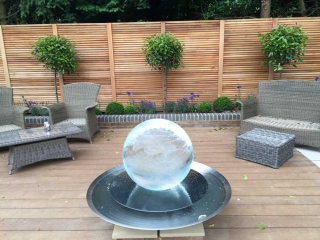 landscaped patio garden with glass feature