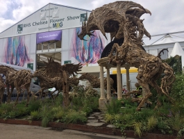 sculptures with chelsea flower show tent in background