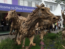 wooden horse sculptures at chelsea flower show