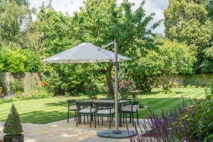 shaded outdoor dining area in landscaped garden