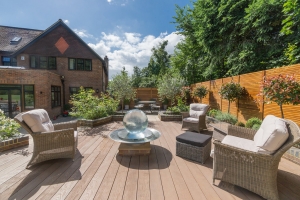 residential garden with glass feature and furniture