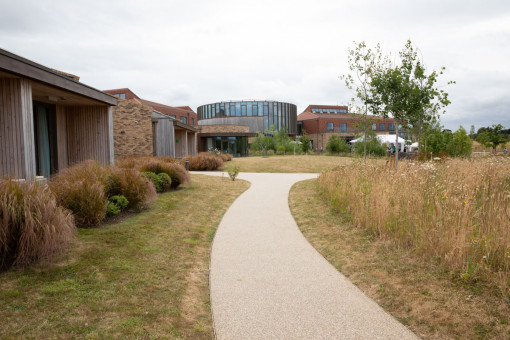 Path through well maintained grounds of care home