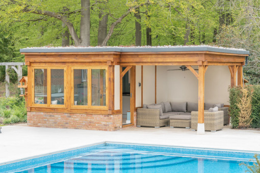 Oak framed pool house with covered seating area