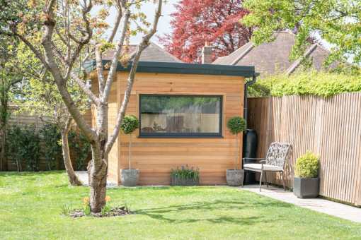 Side shot of garden room surrounded by trees
