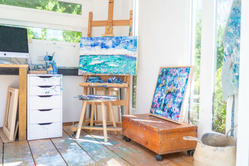 Brightly coloured art in garden studio