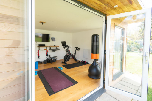 Looking through door into well equipped garden gym