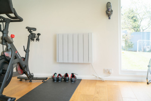 Internal shot of garden gym with exercise bike