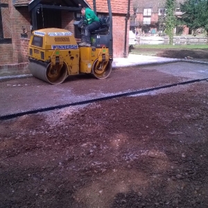 flattening the ground to lay a driveway