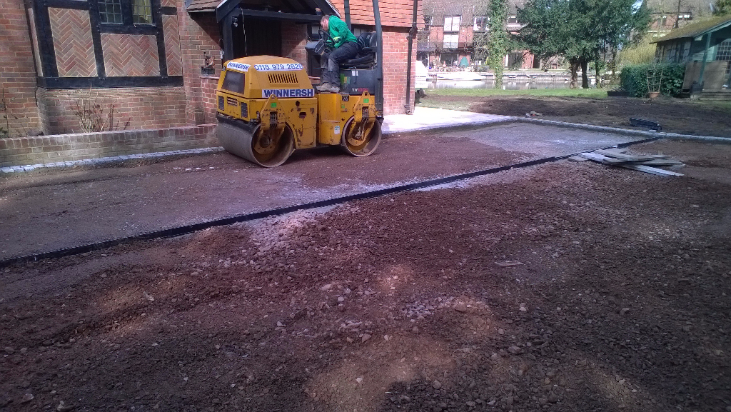 flattening the ground to lay a driveway