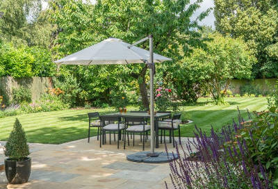 landscaped patio with shaded dining area