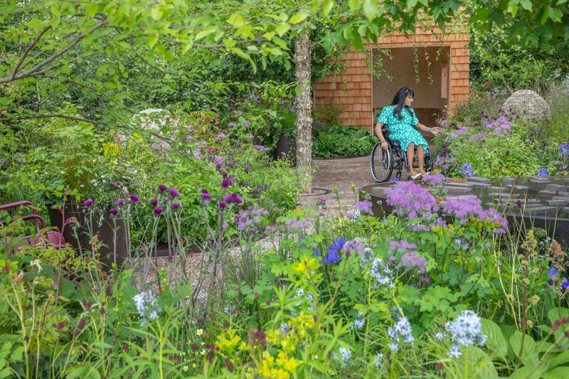 Wheelchair user enjoying Horatio's Garden at Chelsea Flower Show 2023