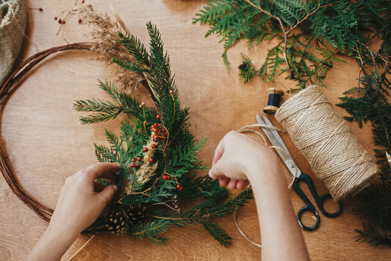 Attaching natural foliage to a wreath