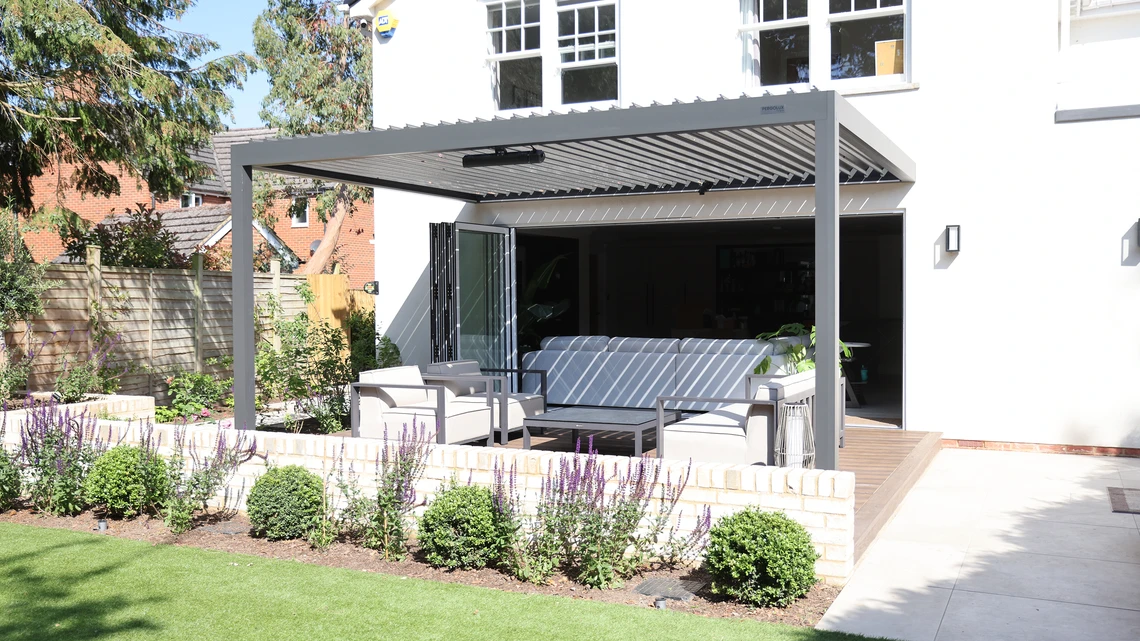 Outdoor seating on Millboard deck with aluminium pergola