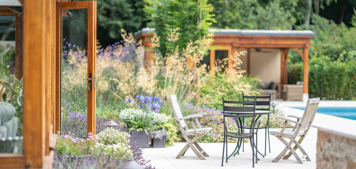 Landscaped patio next to outdoor pool